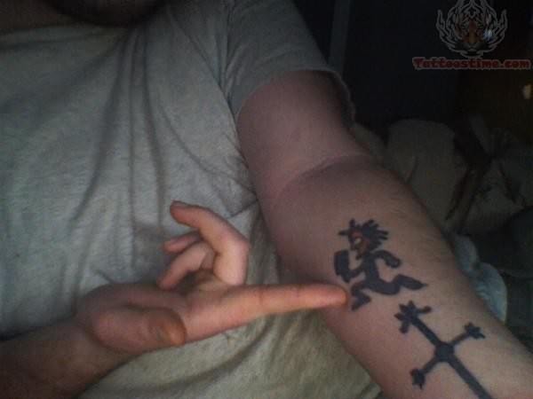 Juggalo And Cross Tattoo On Arm