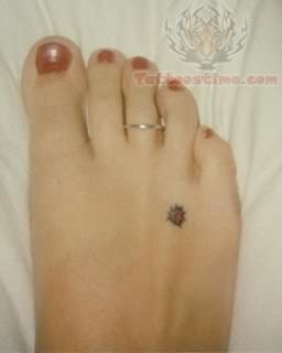 Ladybug Tattoo On Foot