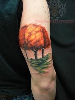 Fire Tree Tattoo On Muscle