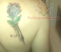 Rose Drug Tattoo On Back Shoulder