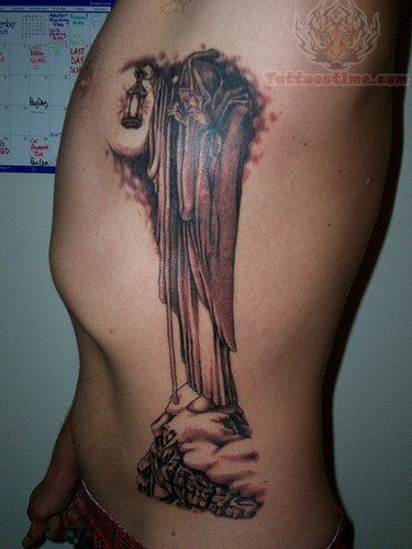 Side Rib Wizard Tattoo