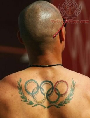 Andres Bayron Silva Showing Olympic Tattoo