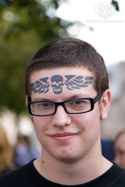 Winged Skull Forehead Tattoo