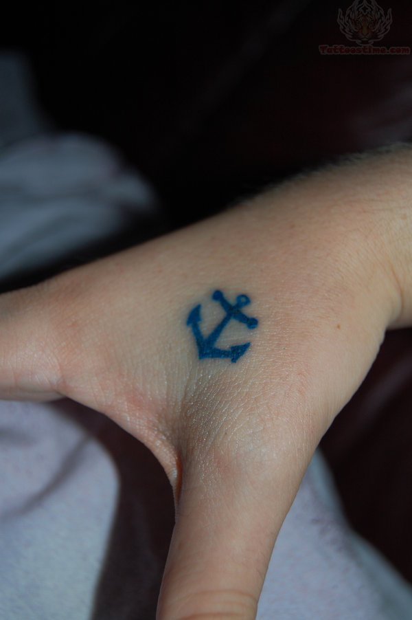 Tiny Anchor Thumb Tattoo