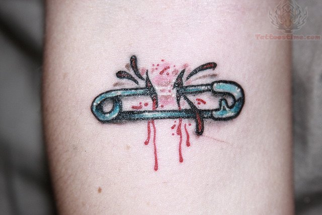 Ripped Skin Safety Pin Tattoo