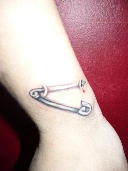 Safety Pin In Skin Tattoo On Arm