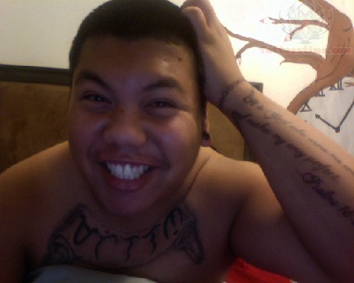 Smiling Guy Have Baybayin Tattoo On Chest