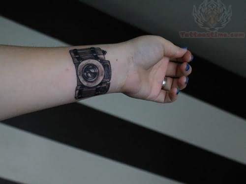 Camera Tattoo On Left Forearm