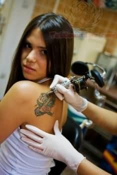 Glue Gun Tattoo On Left Back Shoulder