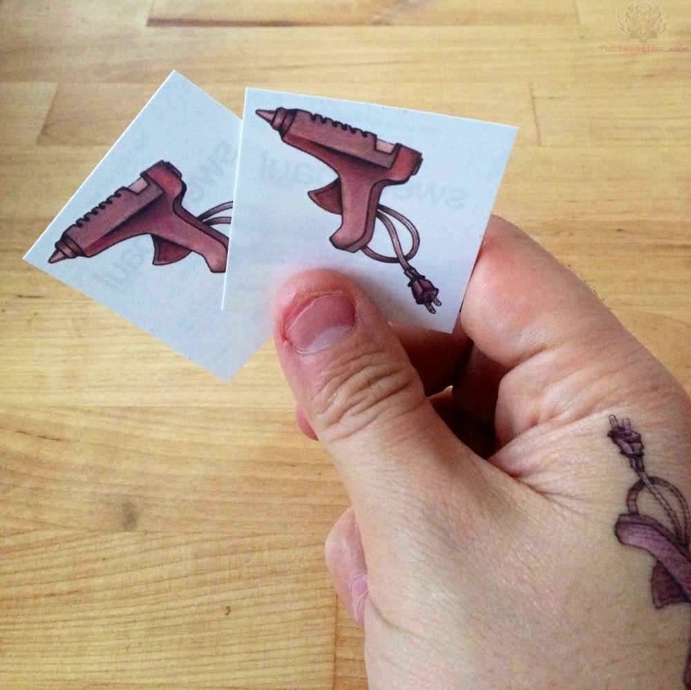 Glue Gun Tattoo On Right Hand
