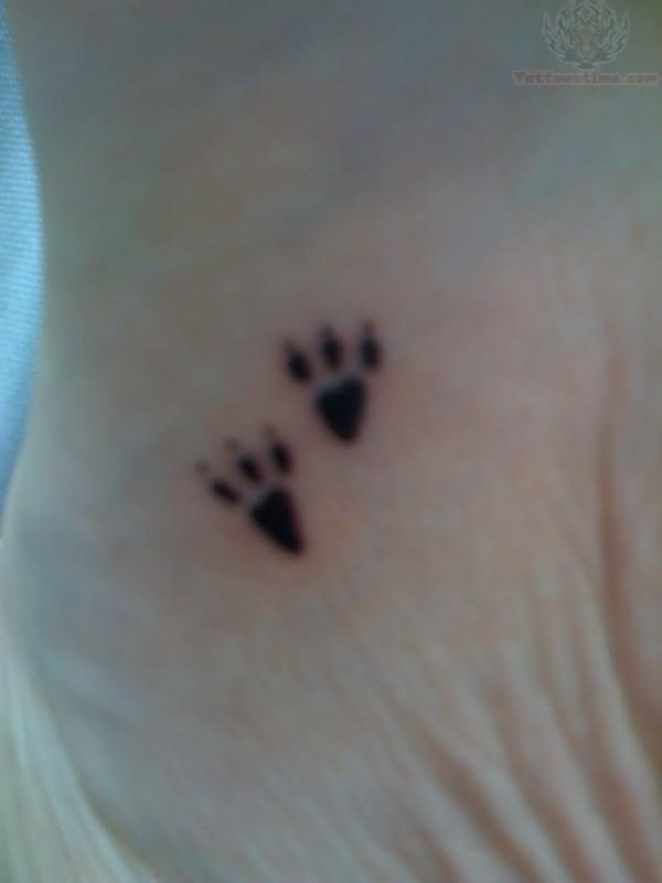 Tiny Paw Prints Tattoos On Sole Of Foot