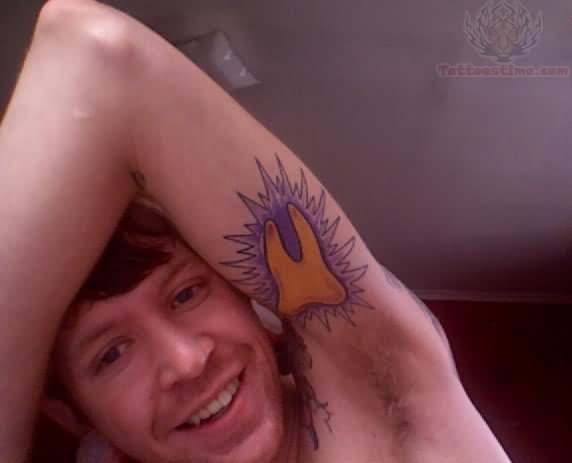 Yellow Ink Molar Tattoo Bicep