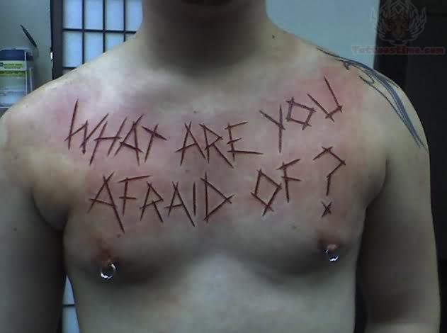 What are You afraid Scarification Tattoo On Chest
