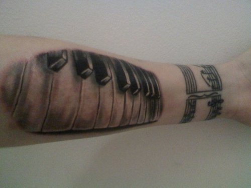 Amazing Grey Ink Forearm Piano Tattoo
