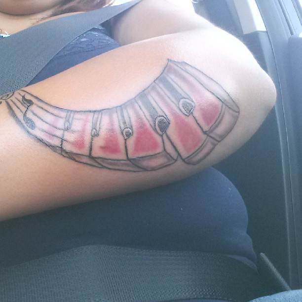 Red ink Piano Keys Tattoo