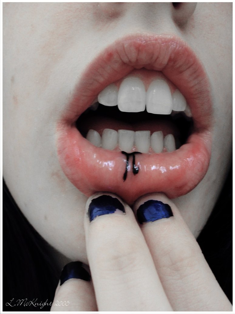 Small Pi Black Ink Tattoo On Lower Lip