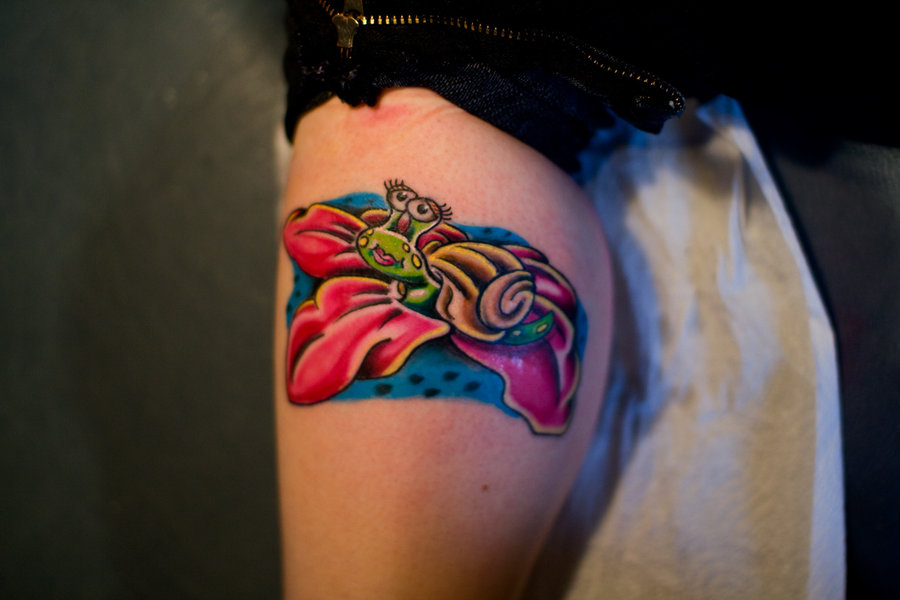 Colored Ink Snail Tattoo On Leg