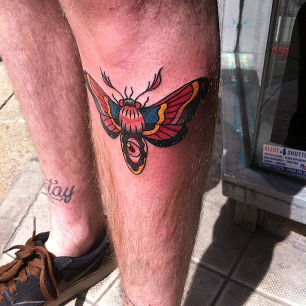 Left Leg Moth Colored Ink Tattoo