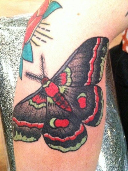 Red And Black Ink Moth Tattoo