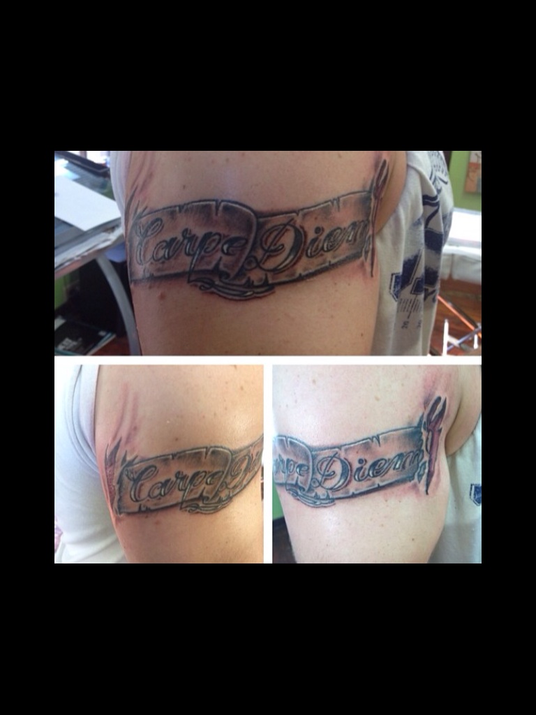 Carpe Diem Ripped Skin Tattoo On Bicep