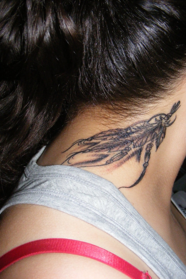 Grey Ink Feather Tattoo On Neck