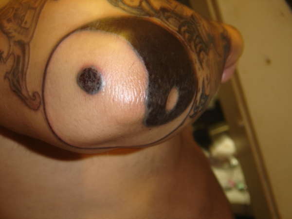 Yin Yang Tattoo On Right Elbow