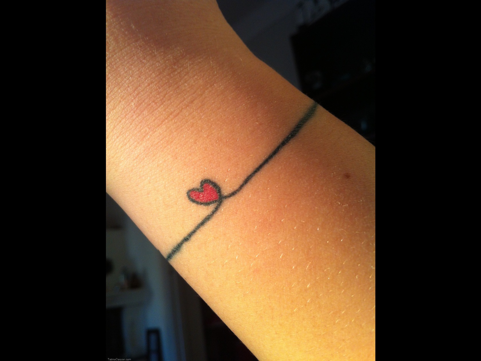 Tiny Red Heart Feminine Tattoo On Wrist