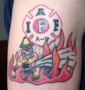 Firefighter In Flames Tattoo On Bicep