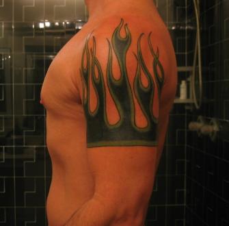 Green And Black Ink Fire and Flame Tattoo On Left Shoulder