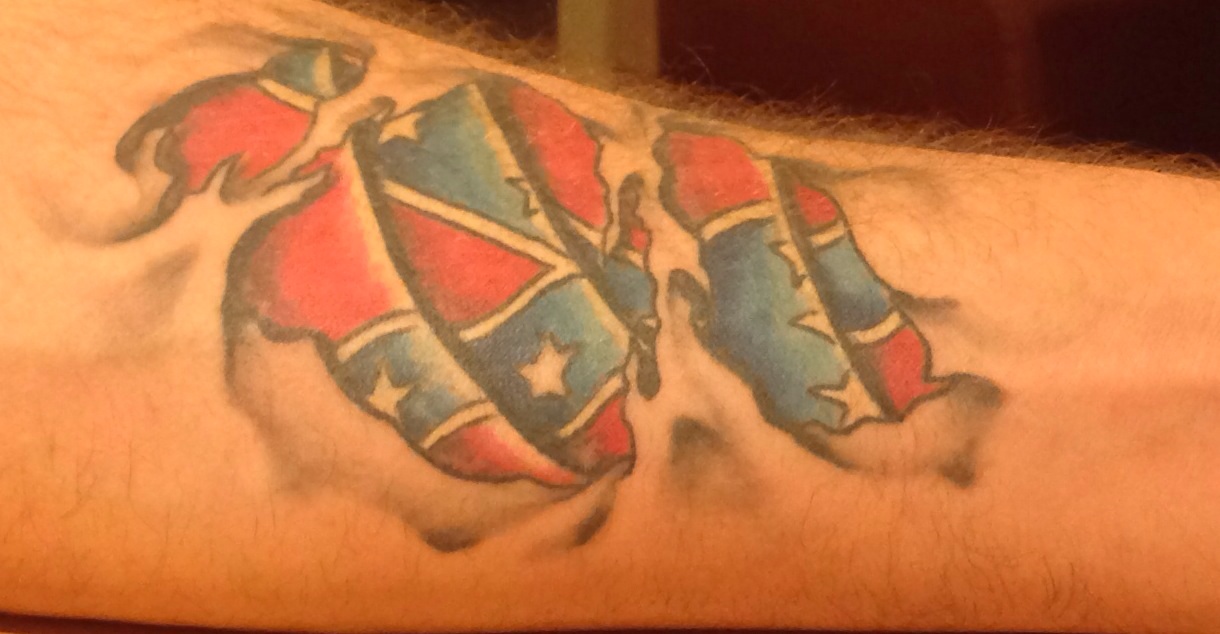 Ripped Skin Flag Tattoo On Arm