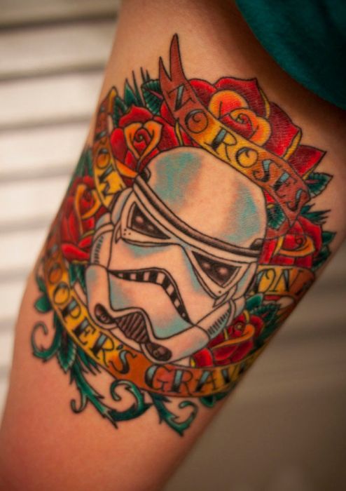 Red Flowers and Geek Soldier Tattoo On Arm