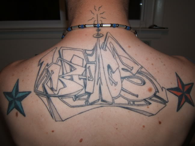 Nautical Stars And Graffiti Tattoo On Man Upperback