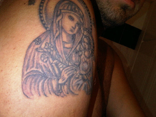 Grey Ink Greek Religious Tattoo