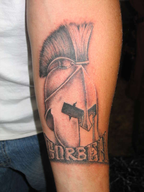 Grey Ink Greek Tattoo On Right Sleeve