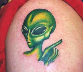 Green Ink Alien Animated Tattoo On Shoulder