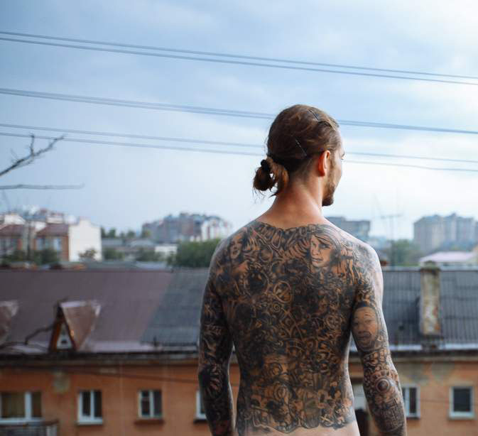 Grey Ink Gambling Tattoo On Back