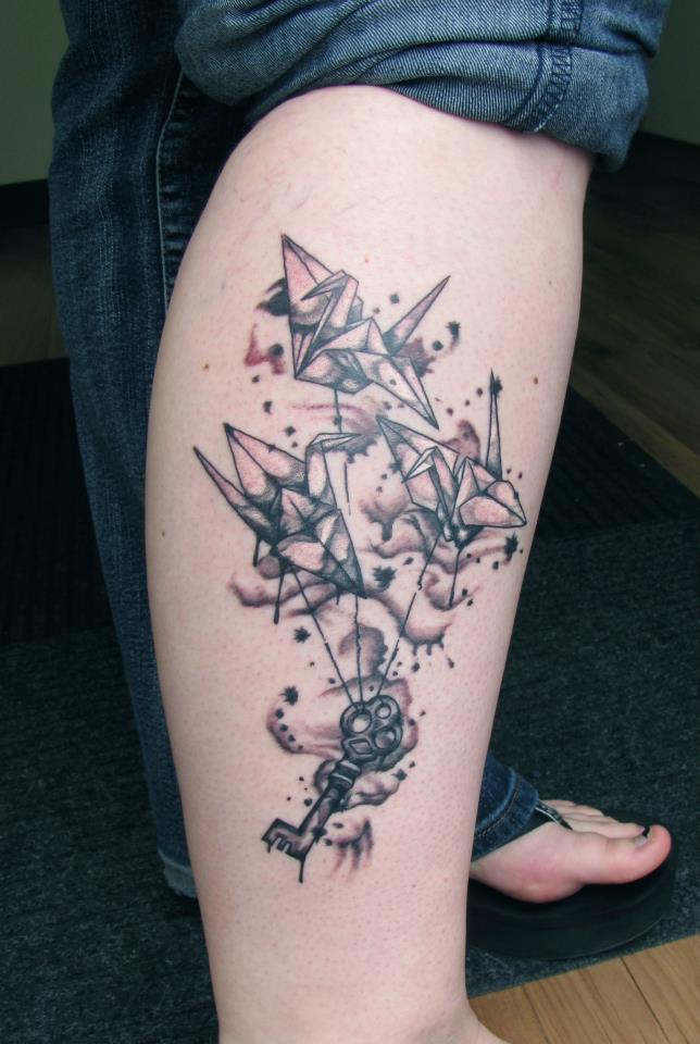Grey Ink Flying Cranes With Key Tattoo On Right Leg