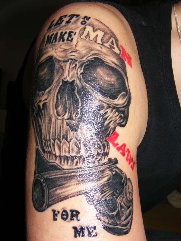 Skull and Gun Tattoo On Right Half Sleeve