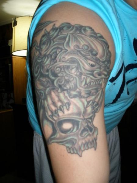 Skull and Foo Dog Tattoo On Man Right Half Sleeve