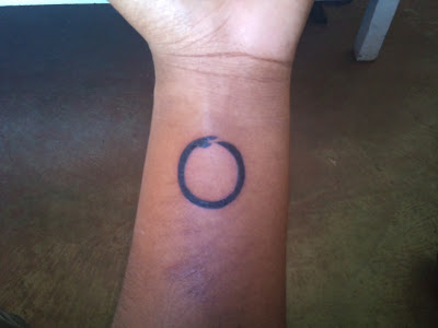 Small Ouroboros Tattoo On Left Wrist