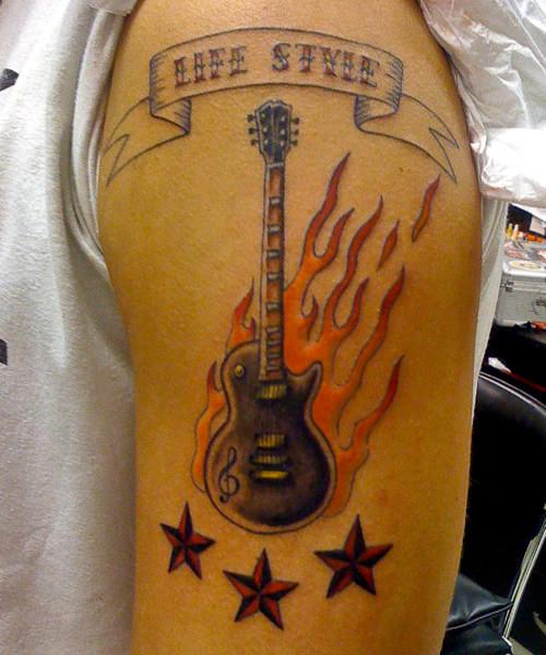 Nautical Stars and Flaming Guitar Tattoo On Half Sleeve