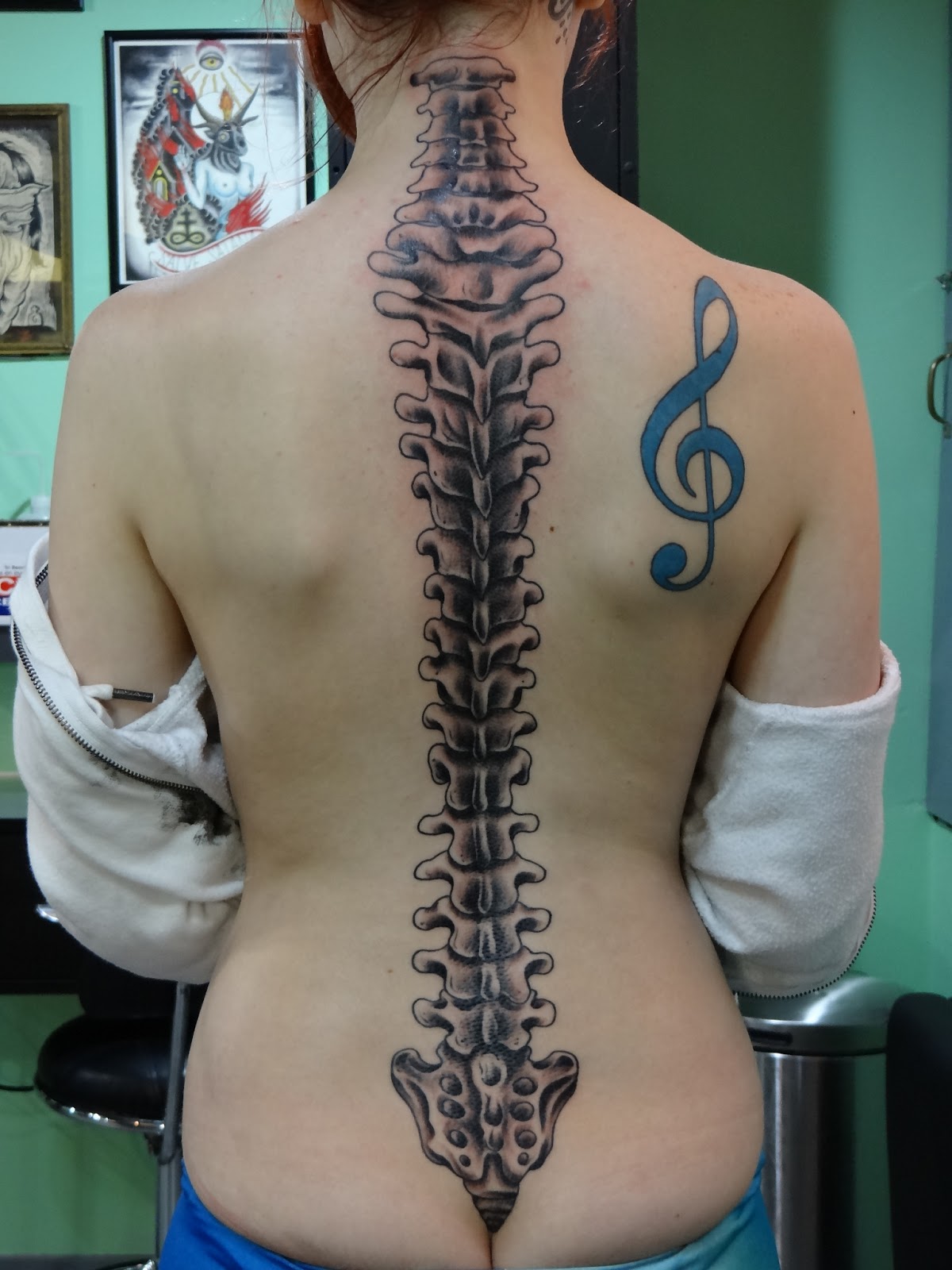Violen Key And Spine Tattoo