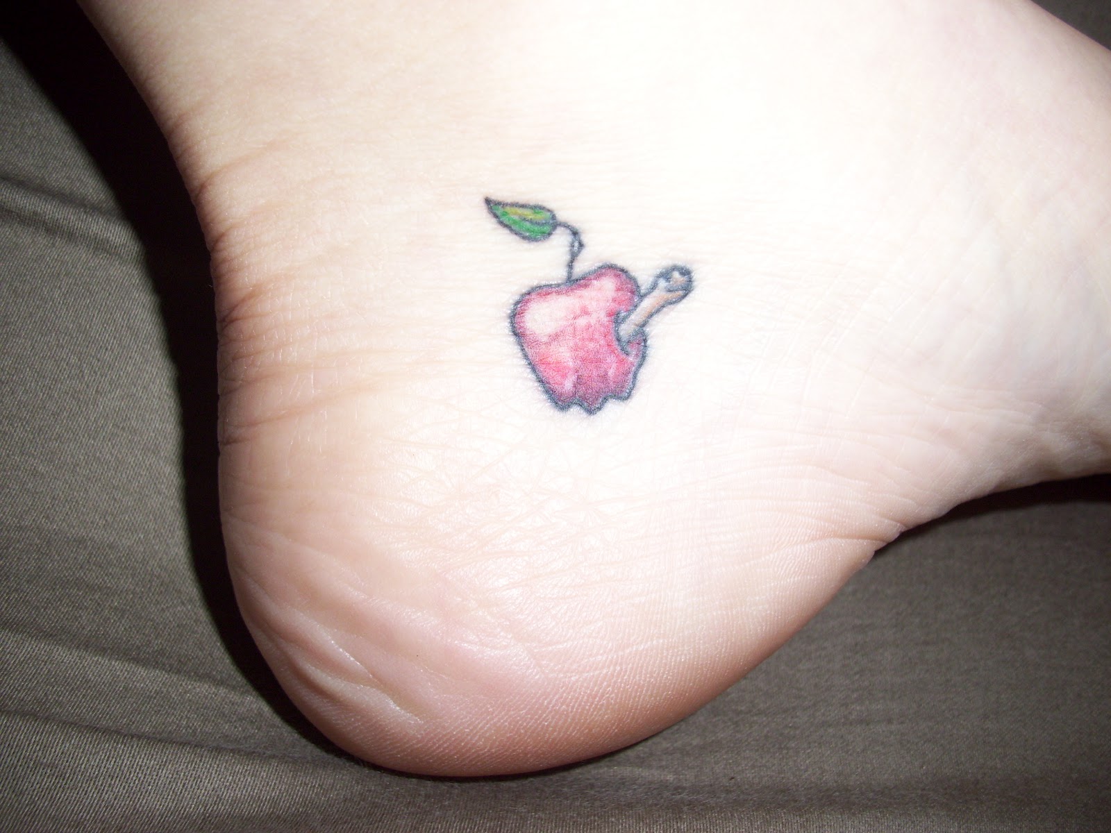 Small Apple And Worm Tattoo