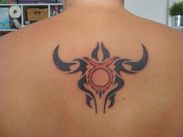 Tribal Taurus Tattoo On Man Upperback