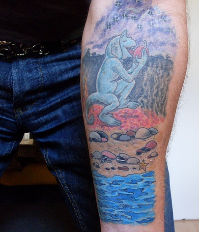 Monkey On Beach Tattoo On Left Sleeve