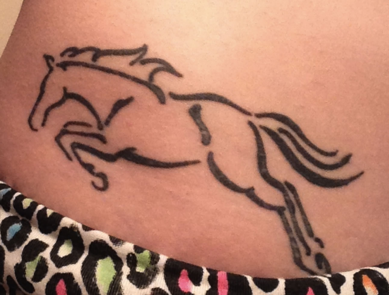Outline Running Horse Tattoo On Lowerback