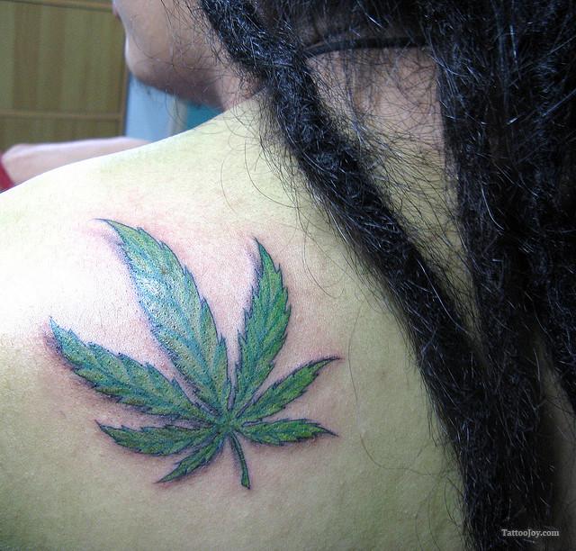Green Ink Marijuana Leaf Tattoo On Left Back Shoulder