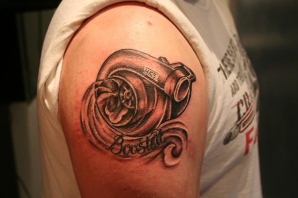 Grey Ink Turbo Tattoo On Right Shoulder