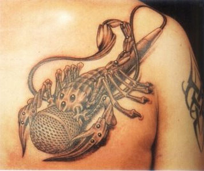 Man Chest Grey Ink Scorpio Tattoo