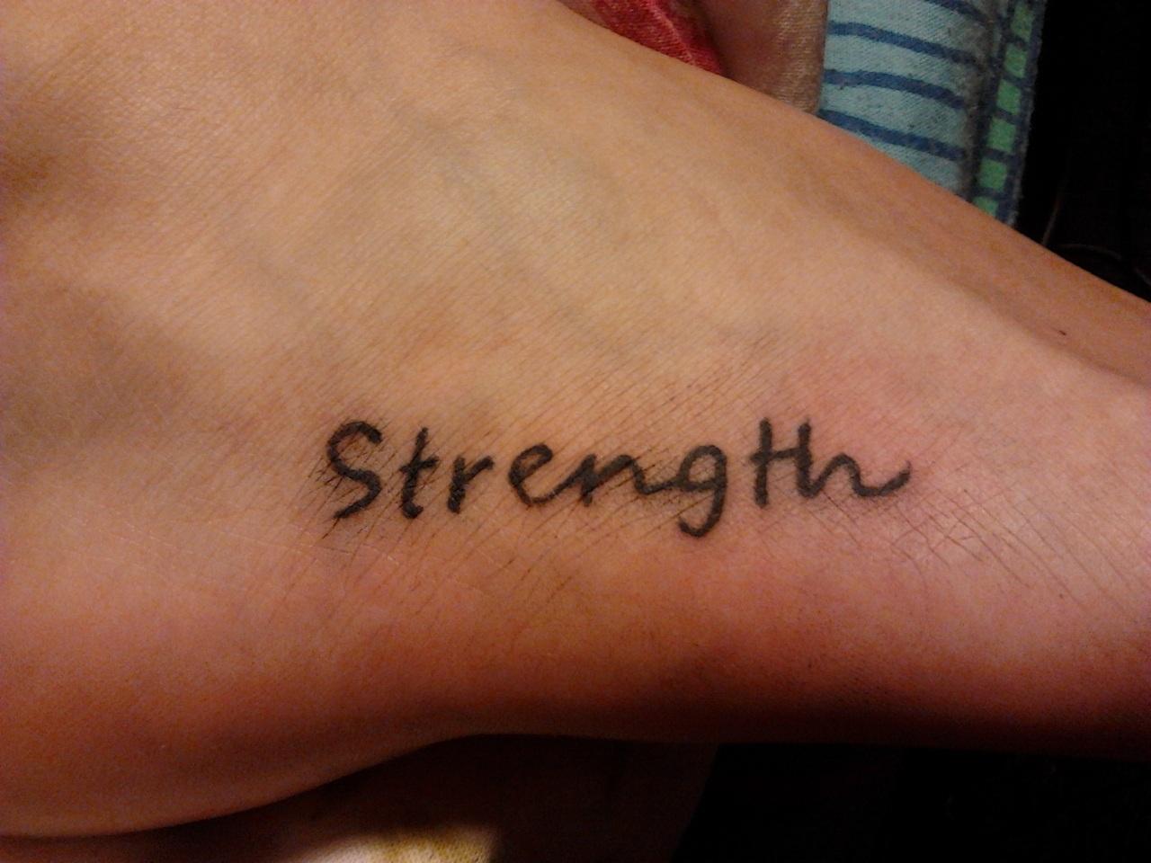 Strength Tattoo on right Foot